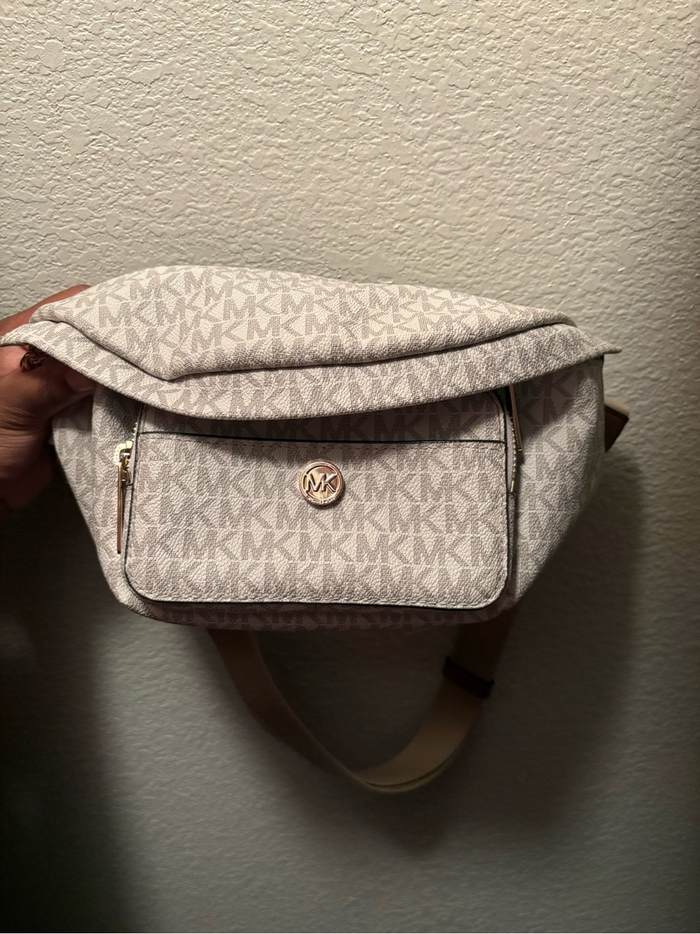 Michael Kors light beige logo crossbody belt bag with gold emblem